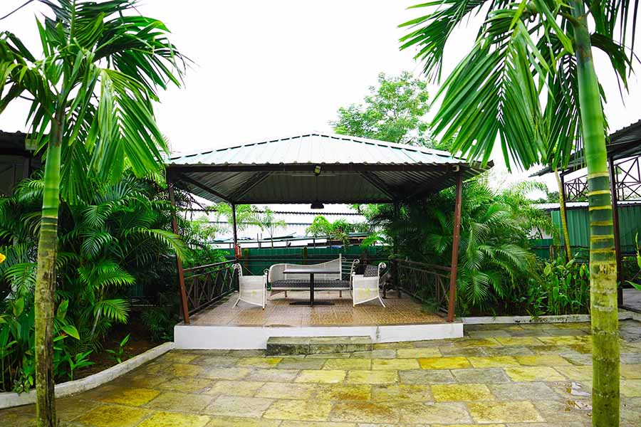 Outdoor sitting area resort in alibagh